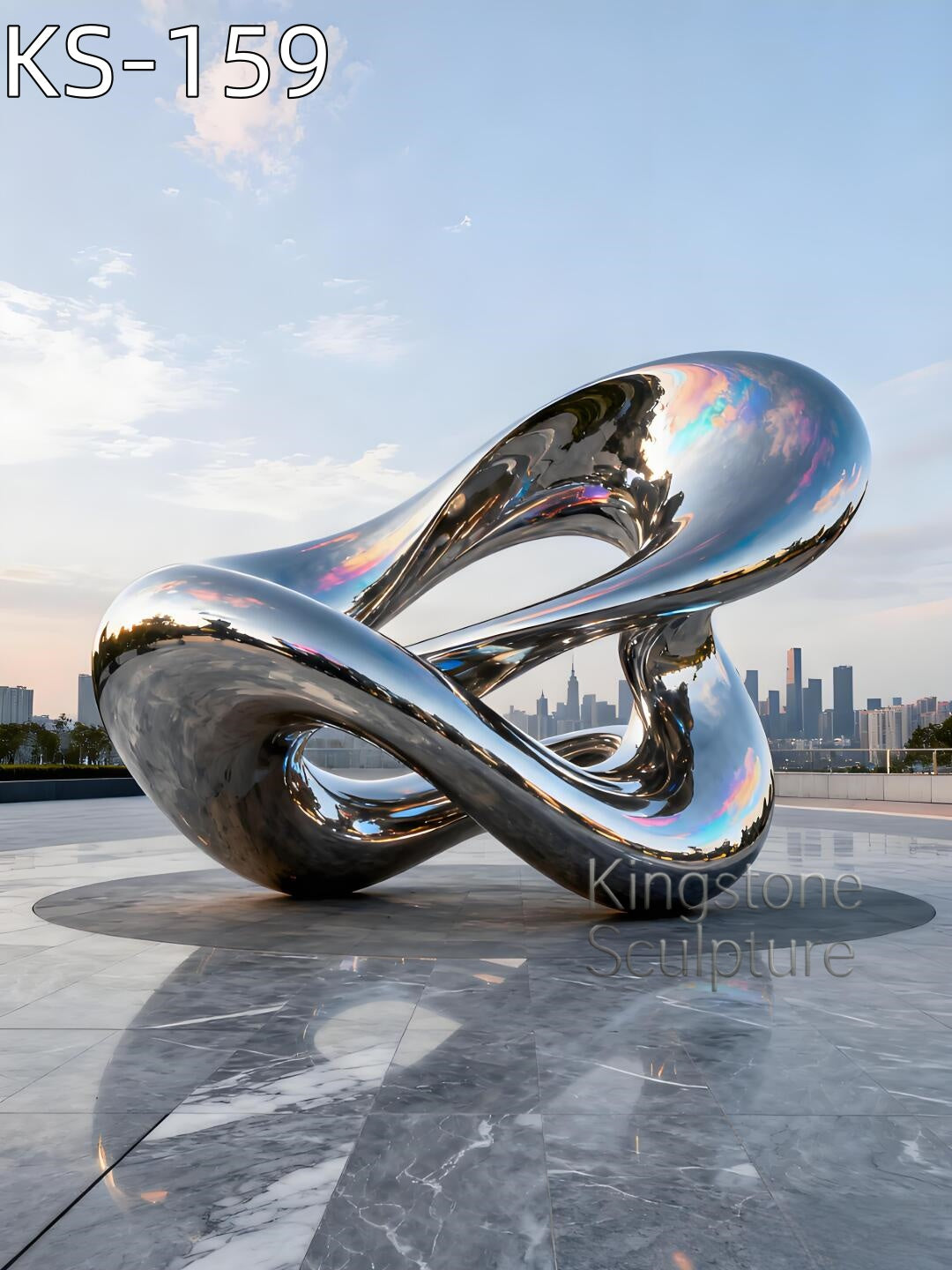 A monumental Kingstone KS-159 mirror polished stainless steel vertical flame sculpture installed in a contemporary outdoor luxury garden.