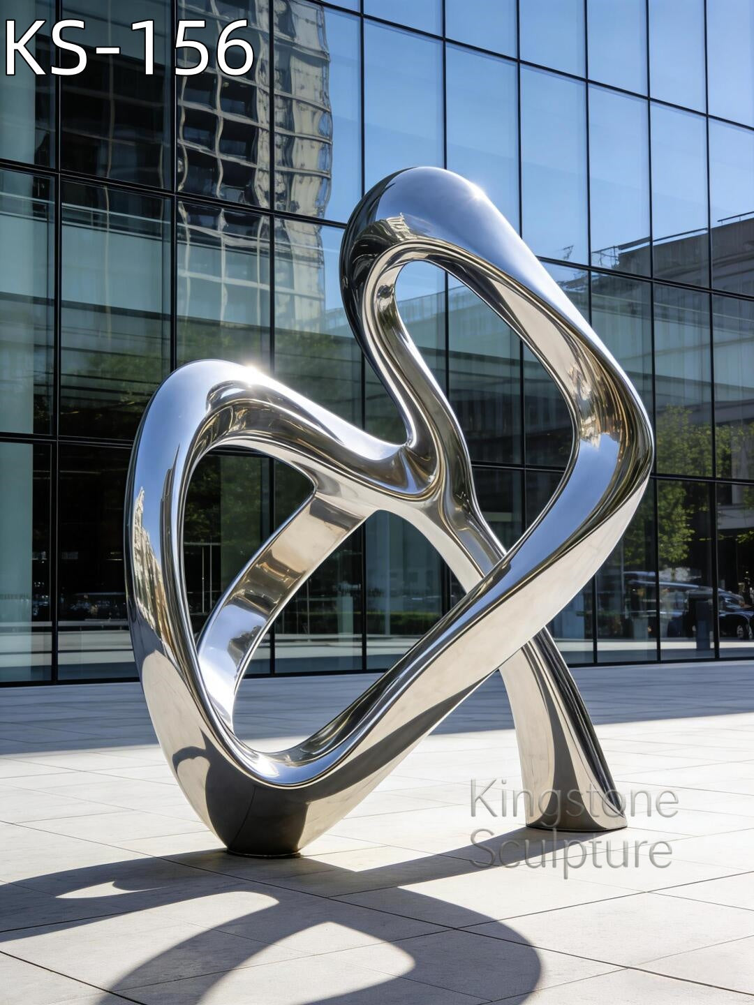 A monumental Kingstone KS-156 mirror polished stainless steel helix sculpture installed in a contemporary luxury garden near a pond.