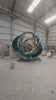 A wide view of finished mirror-polished stainless steel sculptures in the Kingstone warehouse, showcasing our large-scale manufacturing capacity and ready-to-ship inventory.
